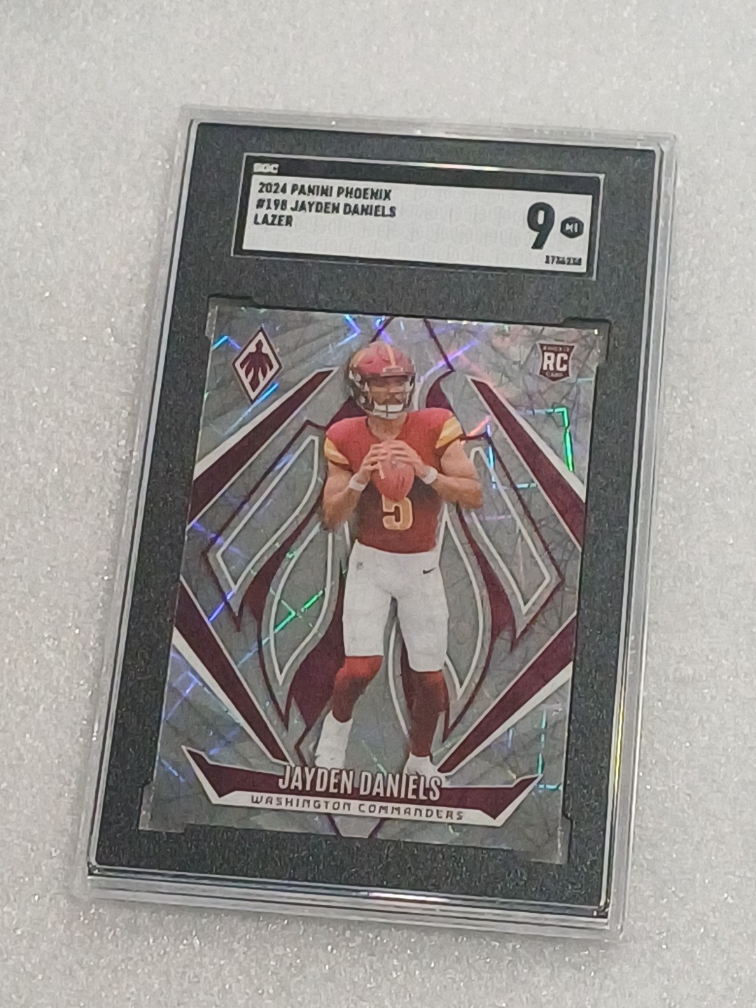 2024 Panini Phoenix - Rookies Jayden Daniels #198 Lazer (RC) Commanders SGC MT 9