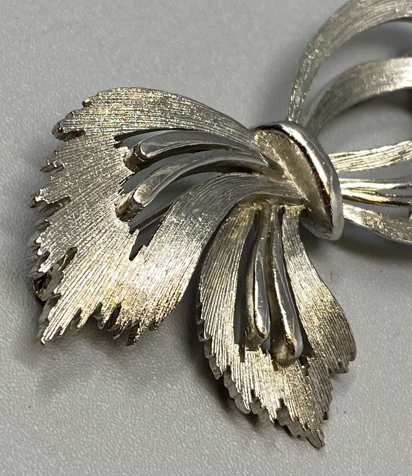Jj Ribbons Vintage JJ Ribbon Brooch Silver Tone Brushed Open Work Bow Textured ...
