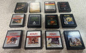 ATARI 2600 console with 25 games , 2 controllers and cords