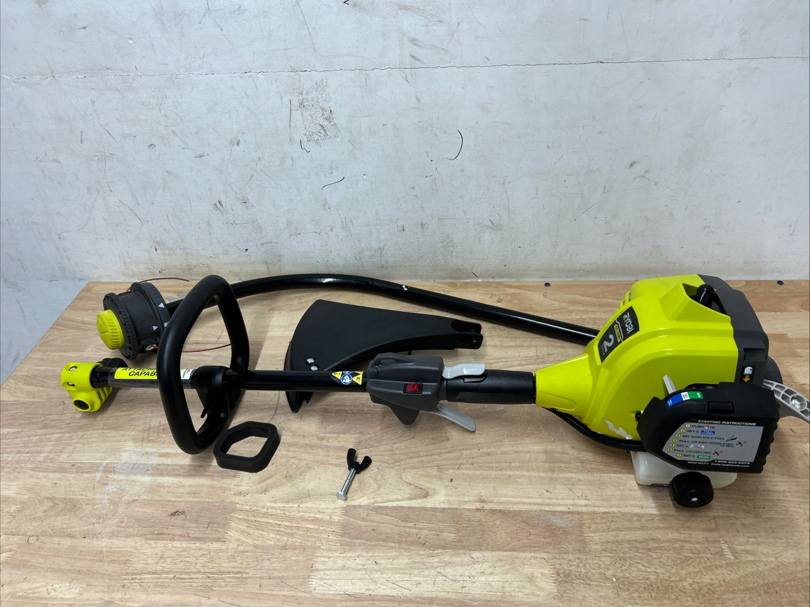RYOBI 25 cc 2-Stroke Attachment Capable Full Crank Curved Shaft Gas String Trimm