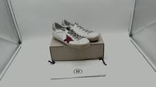 Golden Goose Womens Super Star sneakers with red star and glittery silver heel