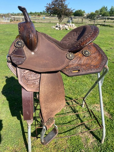 Used 14" feather tooled Western barrel saddle w/brass spots
