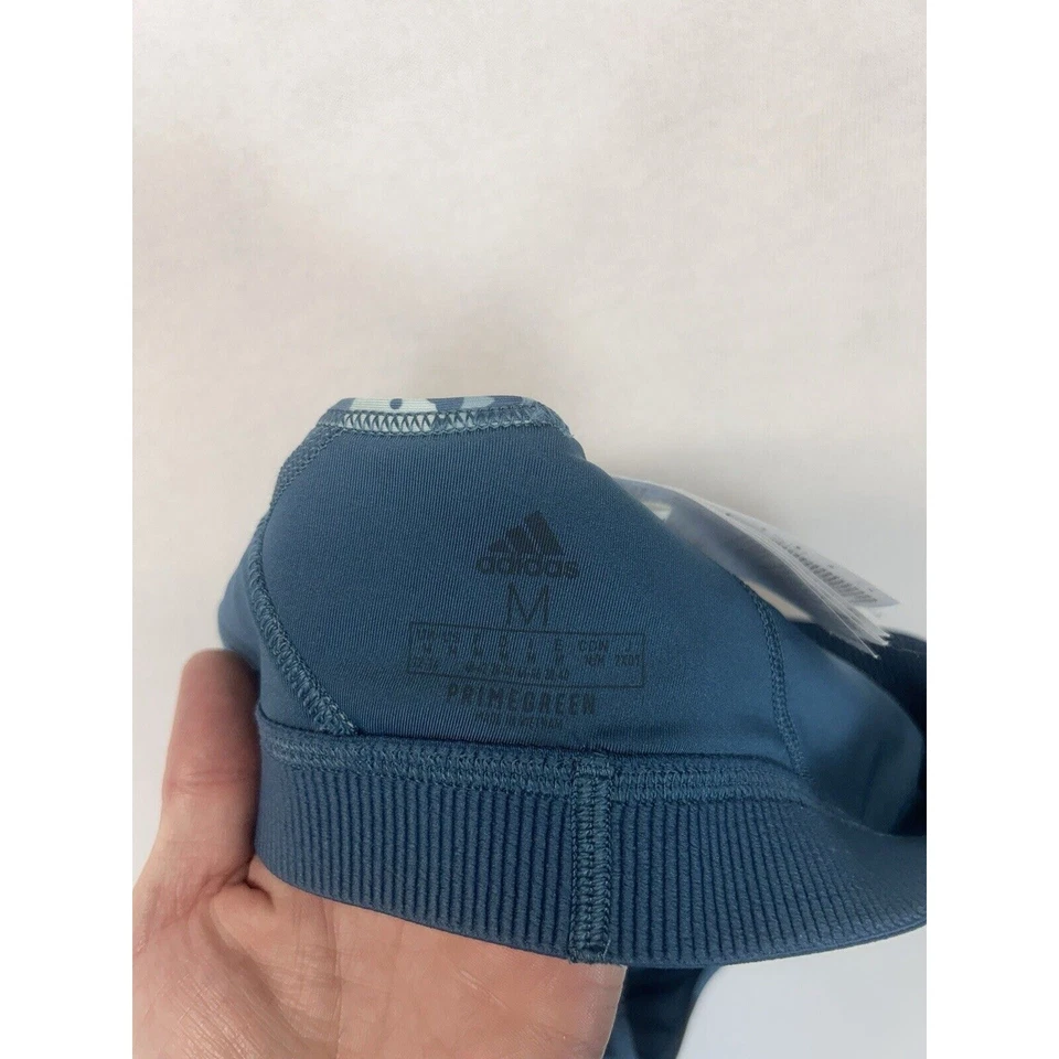 Sujetador deportivo Adidas Peloton para mujer mediano estampado de movimiento digital tonos azules verde primo Foto 4 de 4