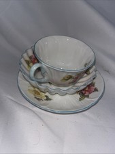 Shelley Fine Bone China teacup and saucer, specifically the "Begonia" pattern.