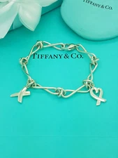 Tiffany & Co. RARE Paloma Picasso Silver with Open Heart and Kiss charm Bracelet