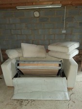 Cream two seater sofa bed. PICK UP ONLY PLEASE.