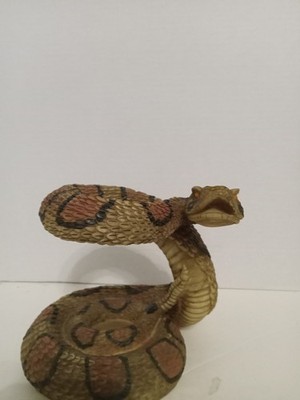 poly resin rattle snake has a tea lite spot on bottom new no box