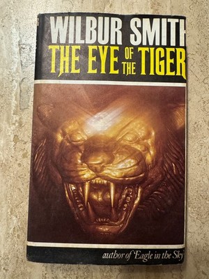 THE EYE OF THE TIGER BY WILBUR SMITH 1ST EDITION HARDBACK 1975 - APPEARS UNREAD
