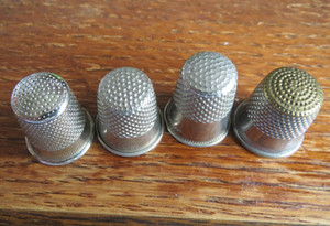 Lot containing 4 Vintage Metal Thimbles ~ Sizes 6, 7, 8 and unnumbered one
