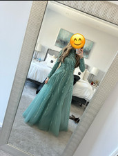Stunning sage green evening gown featuring intricate beading and sequin detailin