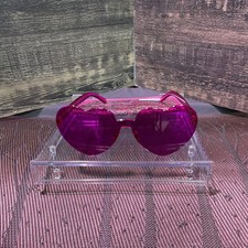 This is a pair of Rose pink heart-shaped sunglasses. Very Unusual Design