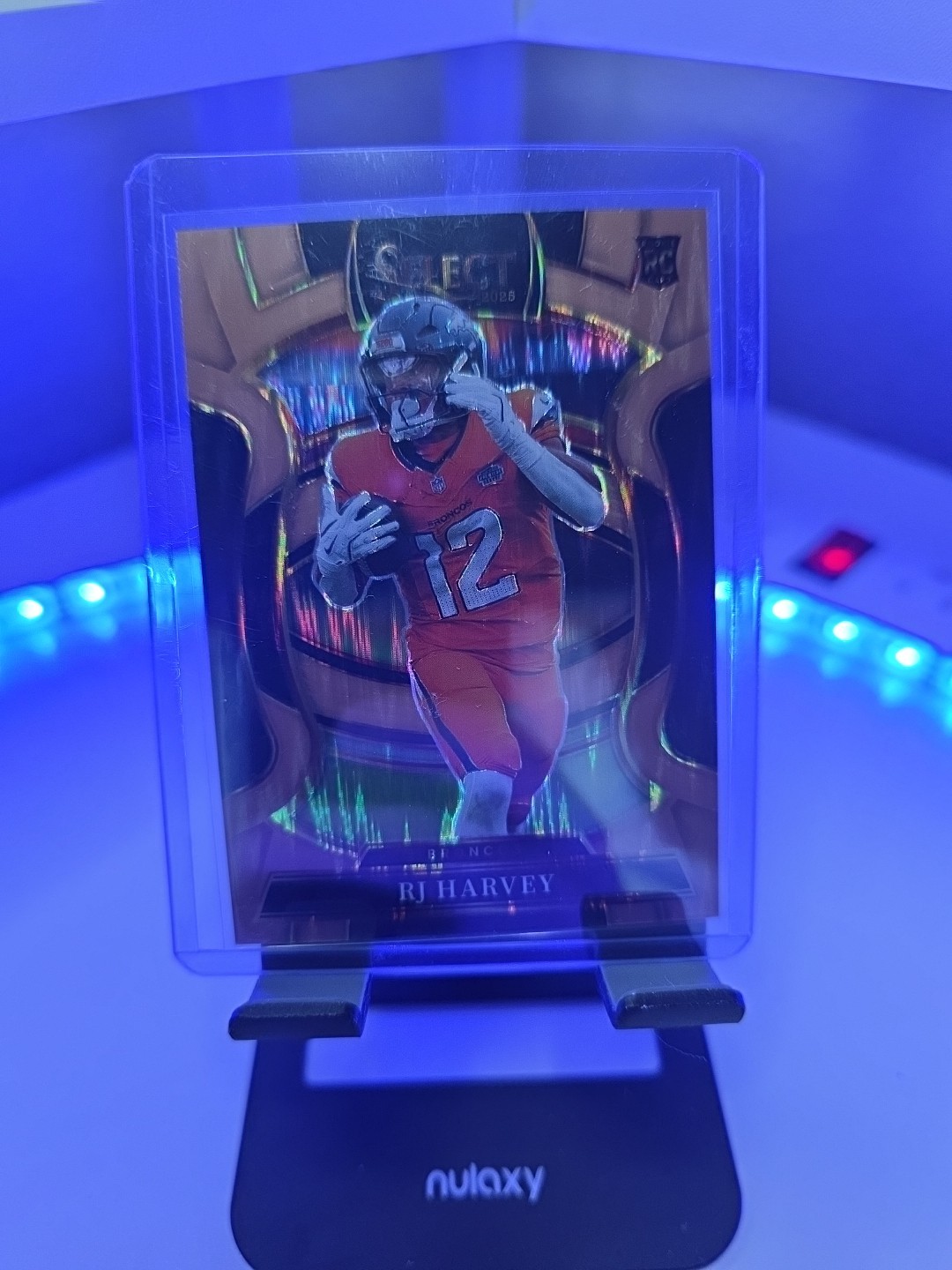 2025 Panini Select - Concourse RJ Harvey #10 Copper Shock Prizm /899 (RC) Bronco