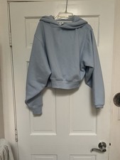 Light blue cropped hoodie with a relaxed fit and ribbed hem and cuffs