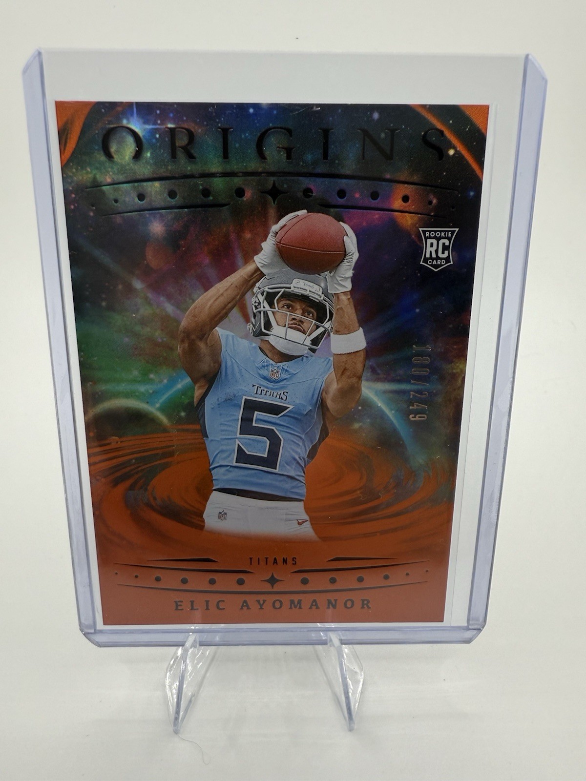 2025 Panini Origins - Rookies Elic Ayomanor, Elic Ayomanor #108 Orange /249 (RC)