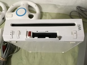 Wii nintendo console & accessories, remote, wheels, nunchuck, power cord,, works