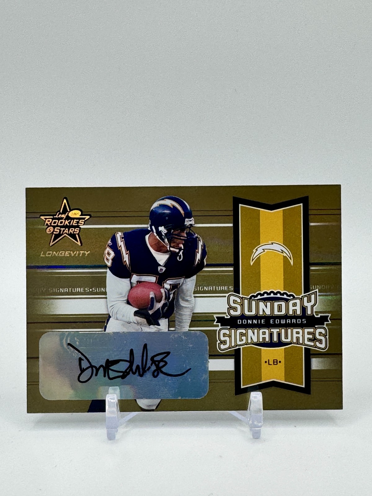2005 Leaf Rookies & Stars Longevity #SS-13 Donnie Edwards Signatures Gold /99