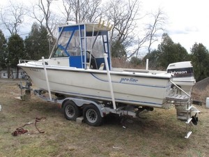 23-foot Proline white, fiberglass open motor boat with Caulkin trailer