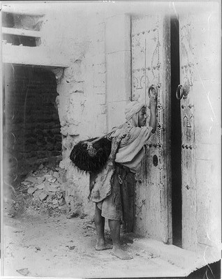 Photo:Porter at Tunis opening large door,c1900,Tunisia,North Africa,man
