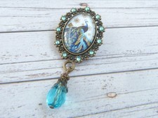 Brosche im Jugendstil Design mit Pfau Motiv türkis bronzefarben Schal Schmuck