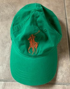 green and orange polo hat