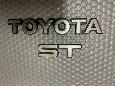 OEM Toyota Celica ST Trunk Lid Emblem – 1990-1993 Rear Nameplate Badge, Silver