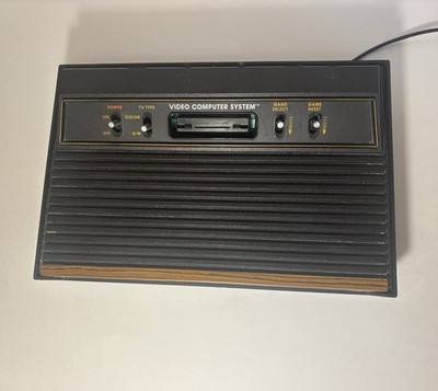 Atari 2600 Video game Console With 18 Games, Controllers, And Manuals