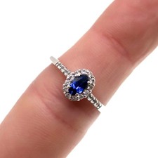 Sterling Silver Oval Created Blue Sapphire Halo Style Ring, Finger Size 7