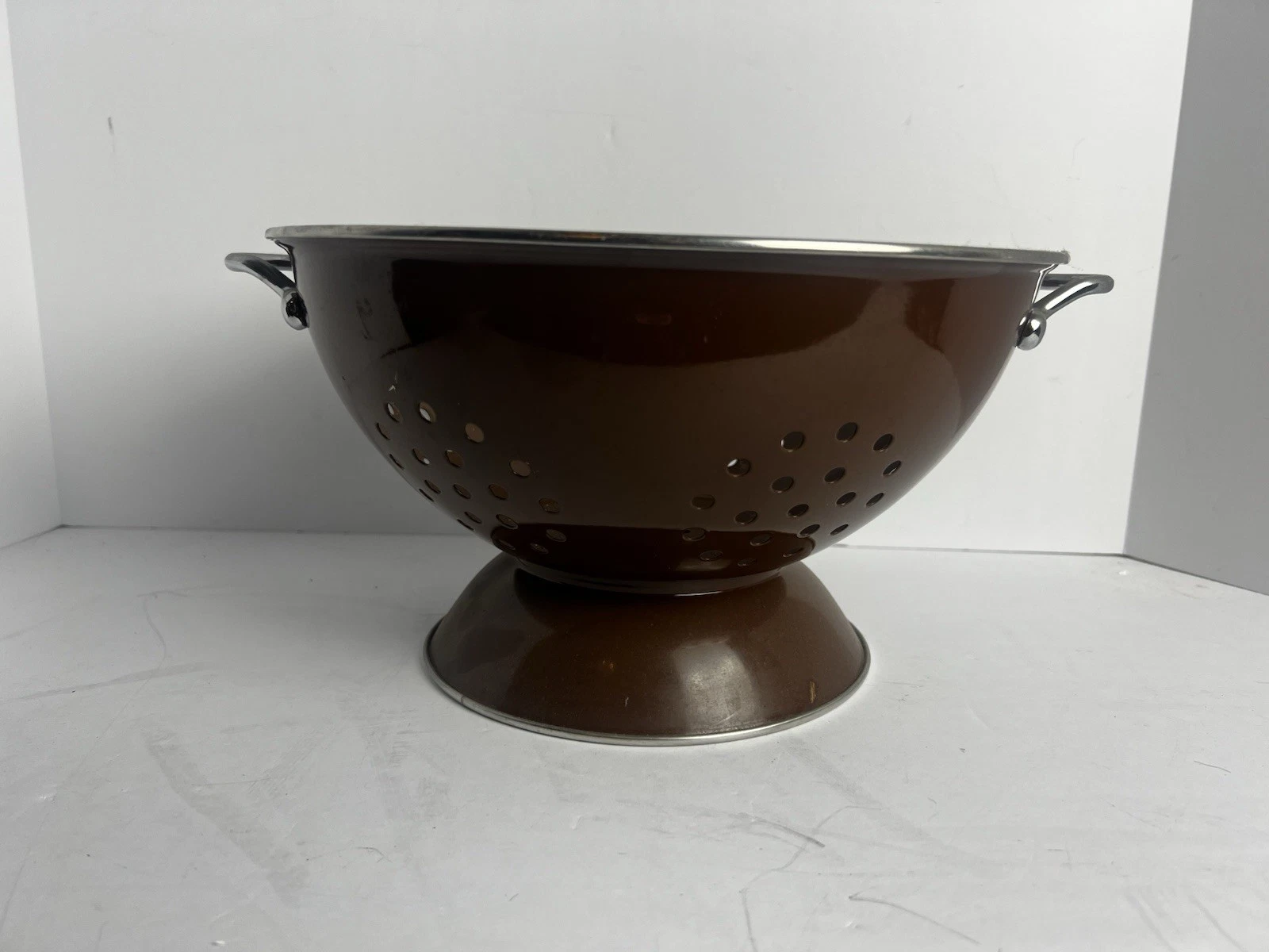 This vintage Brown enamel colander