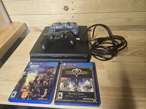 Sony PlayStation 4 Slim 1TB Console Bundle - 2 Games And 2 Controllers