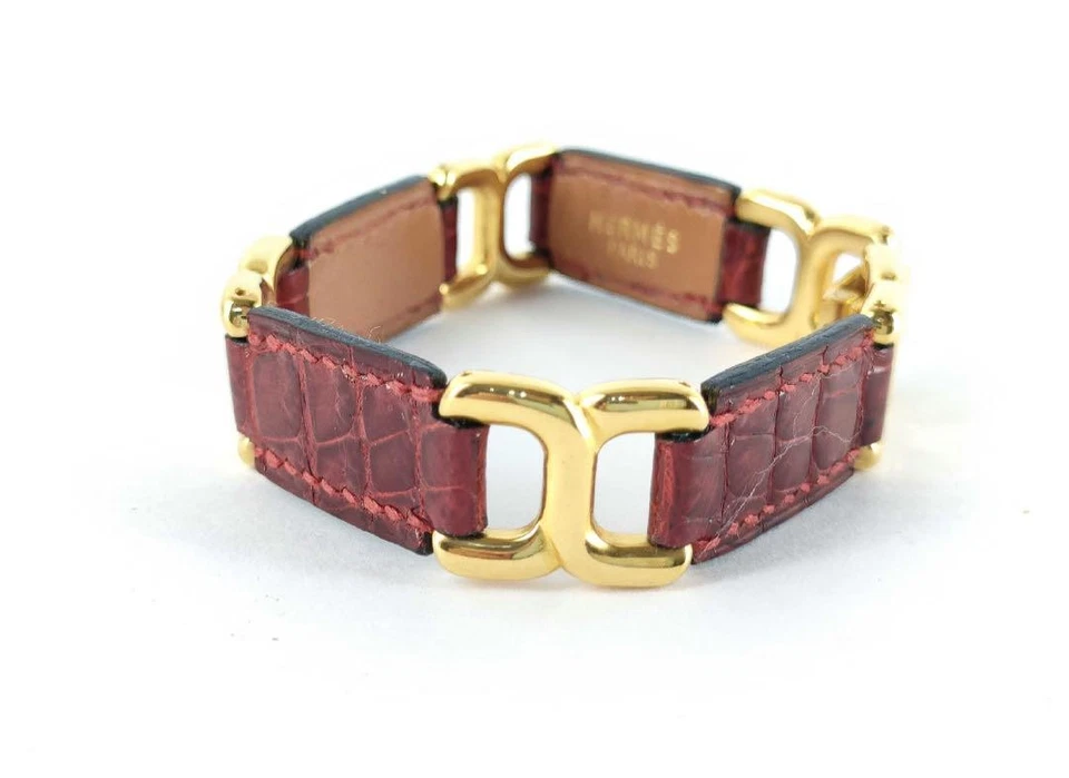 Pulsera Hermes de cuero rojo con cadena dorada usada Foto 3 de 4