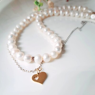 Amazing natural pearl necklace with a heart-shaped pendant on a chain