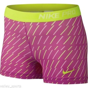 yellow nike compression shorts