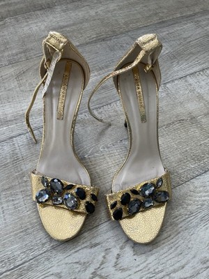 These gold-colored high-heeled sandals appear to be a Zara jeweled leather model