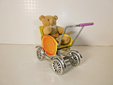 Alter Blech-Puppenwagen mit Teddy aus der ehe...