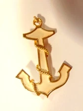 older anchor shaped enameled metal fashion pin; gold & ivory colored