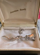 2 Vintage American Beauty Silvertone Floral Brooches 
