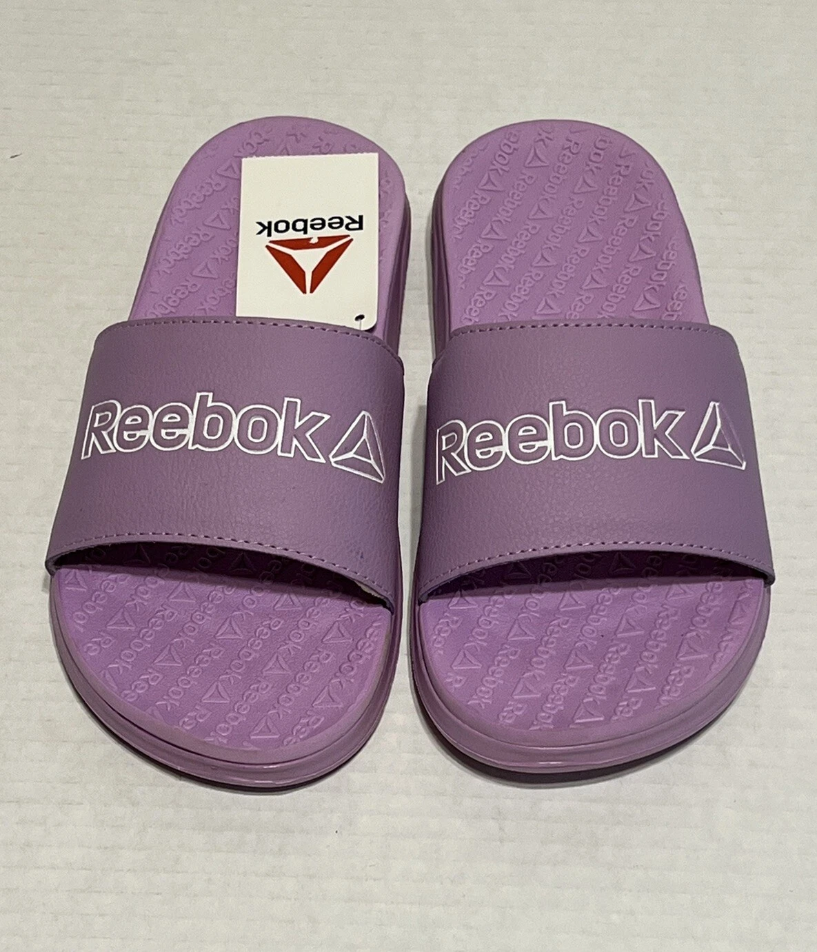 NUOVO Reebok Slides scarpa sandalo viola slip on bambina taglia 4 leggero spiaggia nuovo con etichette