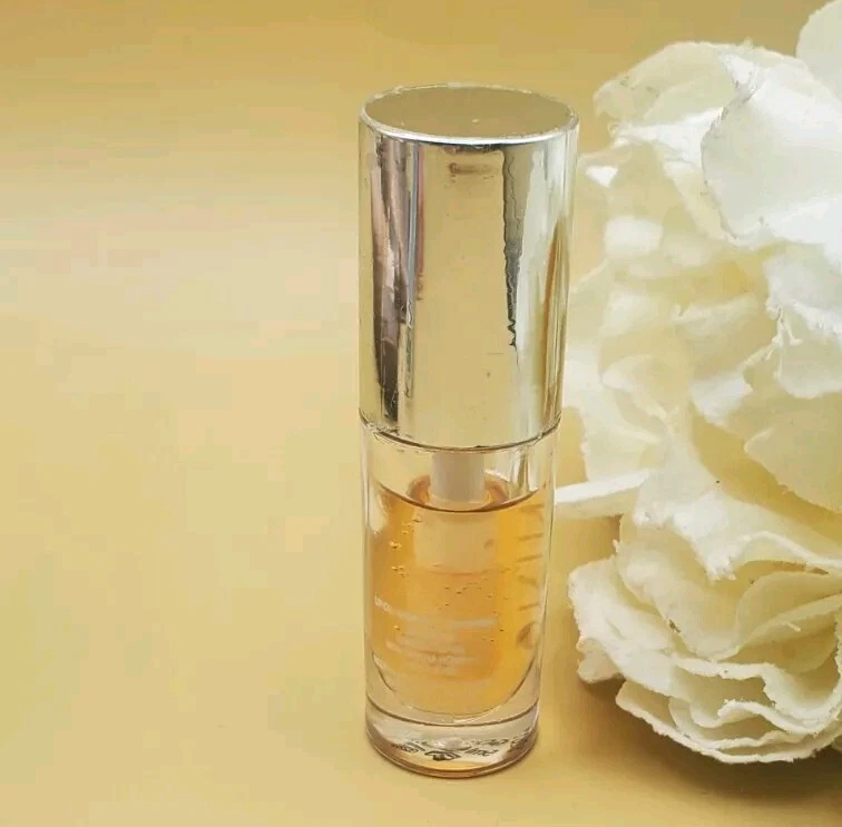 Aceite labial luminoso Skinn Divine Elixir dorado 0,17 oz nuevo sin sello  Foto 3 de 4