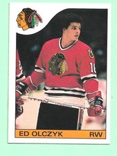 (1) ED OLCZYK 1985-86 O-PEE-CHEE # 86 HAWKS ROOKIE EX/EX+ CARD (N5608). rookie card picture