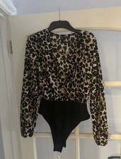 Leopard Print Woman’s Bodysuit Low Cut Neckline One Piece