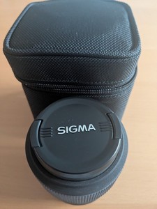 EX Sigma 105mm 1:2.8D Macro DG Nikon Fit Lens, zipped protective bag, hood lamp.