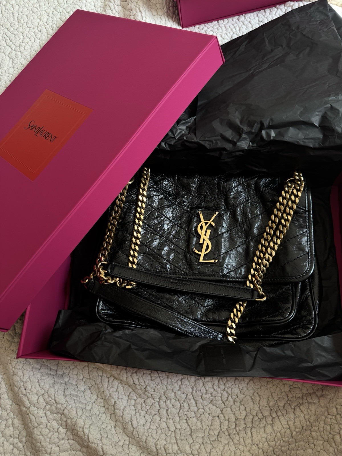 Yves Saint Laurent Niki handbag in vintage leather. Glossy black w/ gold detail