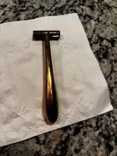 This vintage gold-tone razor is likely an Interpur 31163 model, featuring