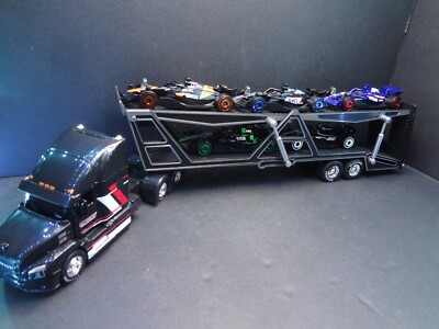 1:64 MACK Anthem Black Car Carrier TRANSPORTER + 5X Hot Wheels Formula 1