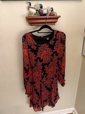 The dress in the image is a Tommy Hilfiger long-sleeved chiffon dress