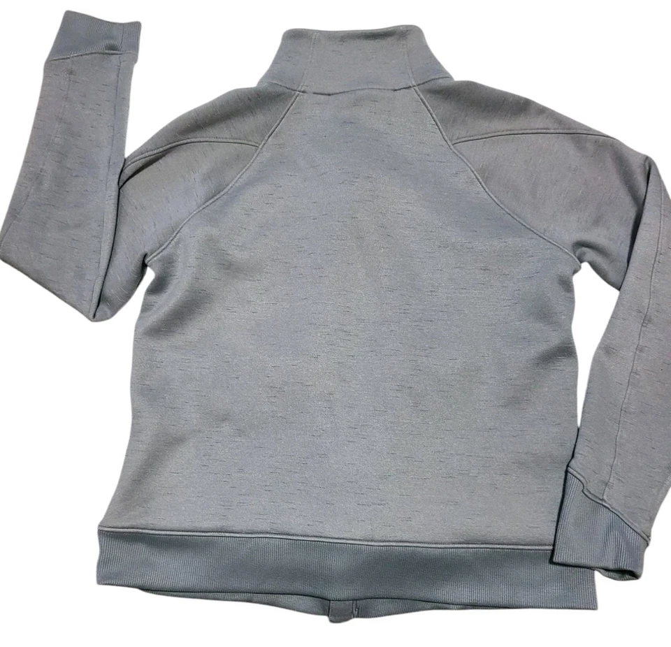 Top Under Armour para mujer polar cremallera completa medio acero gris manga larga Foto 2 de 4