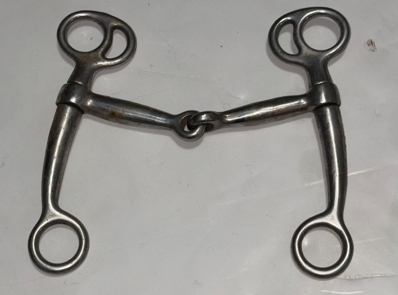 Used stainless steel Tom Thumb horse bit with a single-jointed mouthpiece