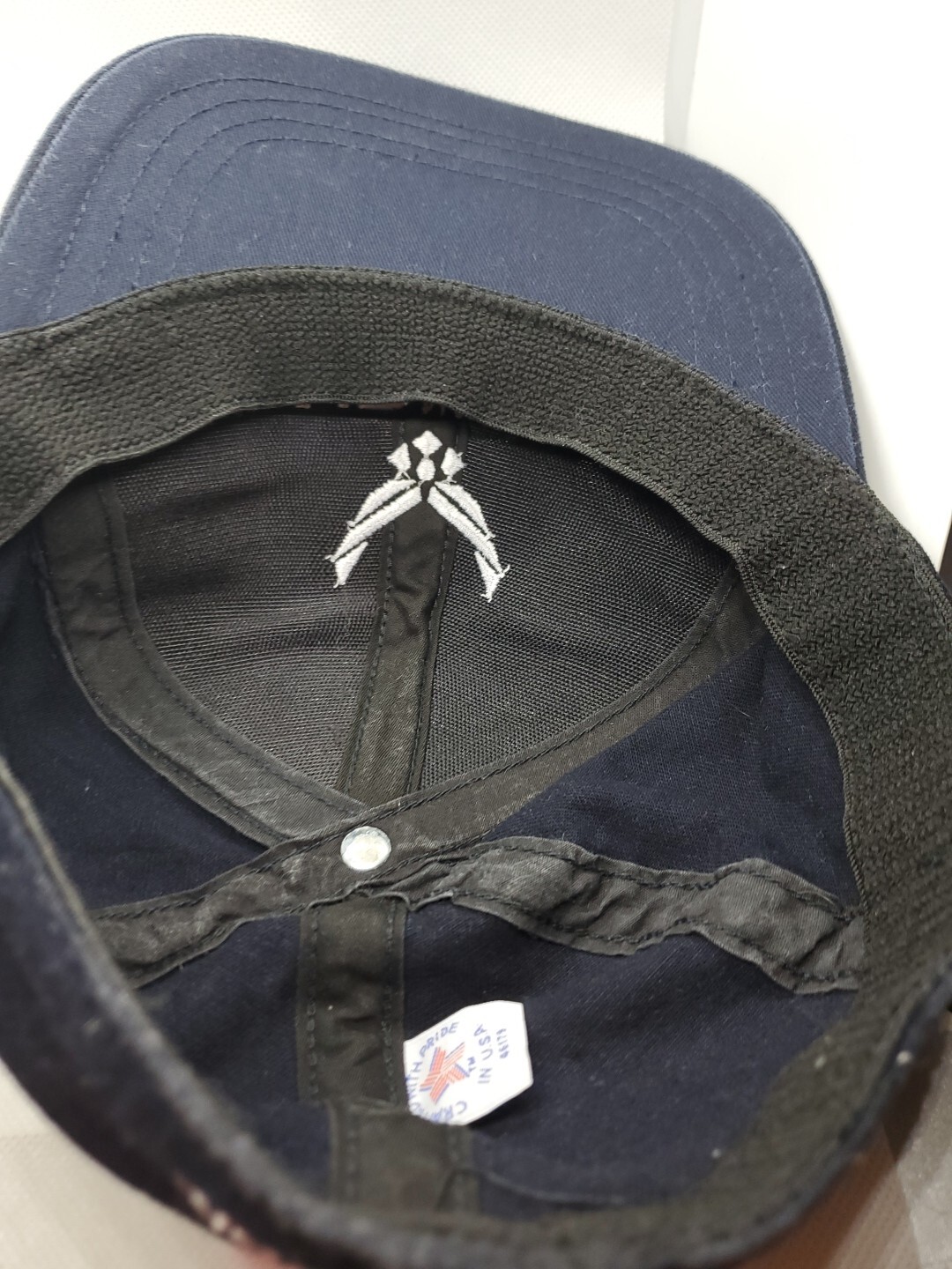 Navy blue fitted hat with white Air National Guard logo and shield emblem on the interior lining.
