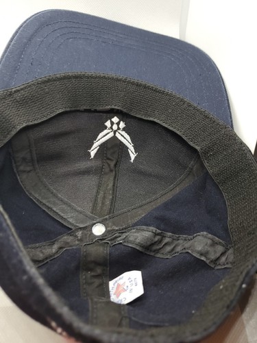 Navy blue fitted hat with white Air National Guard logo and shield emblem on the interior lining.