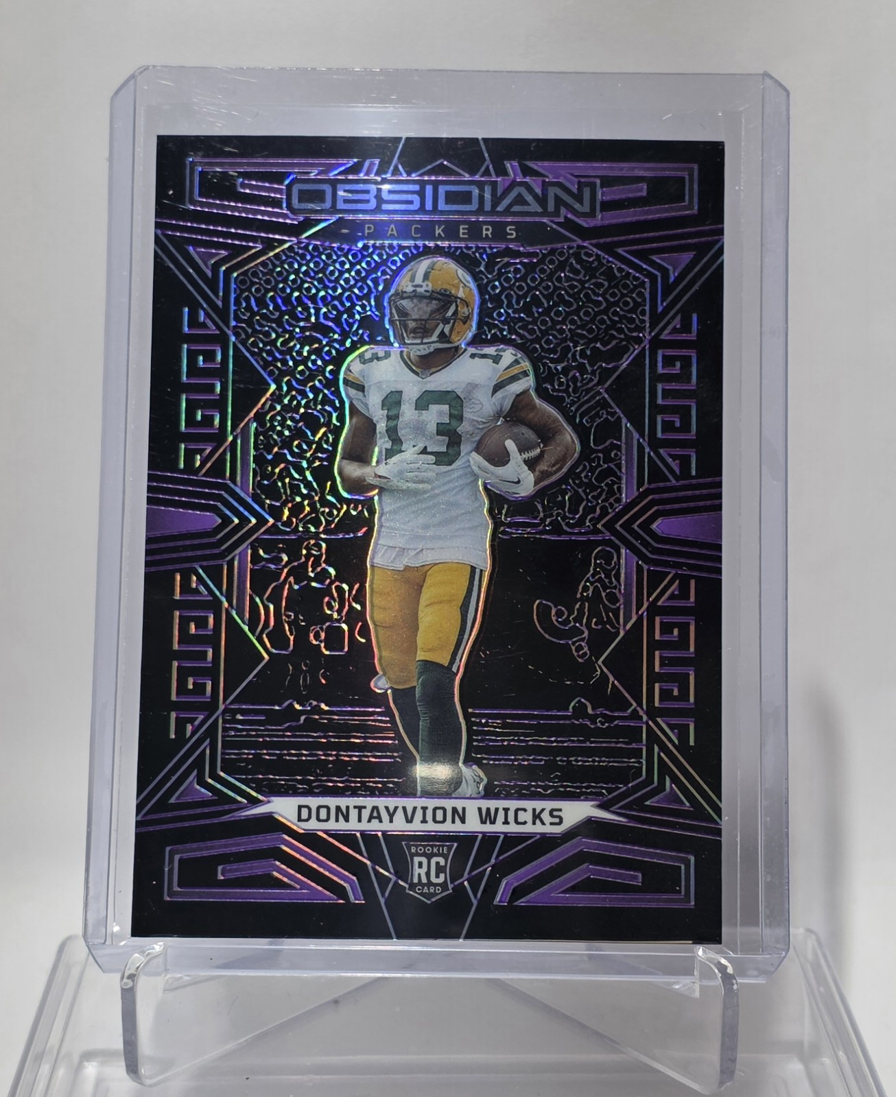 2023 Panini Obsidian #138 Dontayvion Wicks Purple Electric Etch RC /75